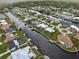 Wide aerial view of a canal-front community at 5234 Cooper Ter, Port Charlotte, FL 33981