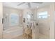 Clean bathroom with a shower and tub combination and modern finishes at 5234 Cooper Ter, Port Charlotte, FL 33981