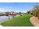 Beautiful canal-front property with private dock and lush lawn at 5234 Cooper Ter, Port Charlotte, FL 33981