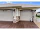 Attached three-car garage with stone accents and decorative lighting at 5234 Cooper Ter, Port Charlotte, FL 33981