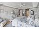 Serene main bedroom with a floral bedding set and a walk-in closet at 5234 Cooper Ter, Port Charlotte, FL 33981