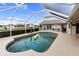 Relaxing kidney-shaped pool with a screened enclosure at 5234 Cooper Ter, Port Charlotte, FL 33981