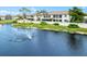 Aerial view of Country Village community by a pond at 7201 29Th Avenue W Dr # 306, Bradenton, FL 34209