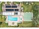 Aerial view of community pool, hot tub, and shuffleboard at 7201 29Th Avenue W Dr # 306, Bradenton, FL 34209