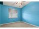 Blue bedroom with carpet flooring and window coverings at 7201 29Th Avenue W Dr # 306, Bradenton, FL 34209