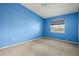 Empty blue bedroom with ceiling fan at 7201 29Th Avenue W Dr # 306, Bradenton, FL 34209