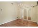 Dining room with wood flooring, chandelier, and built-in shelving at 7201 29Th Avenue W Dr # 306, Bradenton, FL 34209