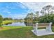 Peaceful pond view with a park bench at 7201 29Th Avenue W Dr # 306, Bradenton, FL 34209