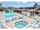 Inviting pool and hot tub area with plenty of lounge chairs at 7201 29Th Avenue W Dr # 306, Bradenton, FL 34209