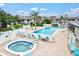 Relaxing pool and hot tub area with plenty of lounge chairs at 7201 29Th Avenue W Dr # 306, Bradenton, FL 34209