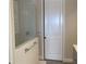 Bathroom with shower and a white door at 1045 Crosswind Ave, Sarasota, FL 34240