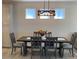 Dining room with a dark wood table and gray chairs at 1045 Crosswind Ave, Sarasota, FL 34240