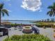 Cozy fire pit area overlooking a lake, perfect for relaxing at 1045 Crosswind Ave, Sarasota, FL 34240