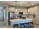 Modern kitchen with an island, stainless steel appliances, and light-colored cabinets at 1045 Crosswind Ave, Sarasota, FL 34240