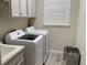 Well-appointed laundry room with Samsung washer and dryer at 1045 Crosswind Ave, Sarasota, FL 34240