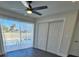 Bedroom with pool view and sliding glass doors at 150 Rotonda Cir, Rotonda West, FL 33947