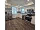 Modern kitchen featuring stainless steel appliances and white cabinets at 150 Rotonda Cir, Rotonda West, FL 33947