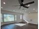 Bright living room with large window and vinyl plank flooring at 150 Rotonda Cir, Rotonda West, FL 33947