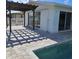 Spacious patio with pergola and pool access at 150 Rotonda Cir, Rotonda West, FL 33947