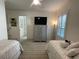 View of bedroom showing the neutral decor, carpet, and ensuite access at 15618 Castle Park Ter, Lakewood Ranch, FL 34202