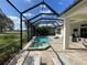 A screened in pool and spa with an outdoor seating area, offering a luxurious outdoor living space at 15618 Castle Park Ter, Lakewood Ranch, FL 34202