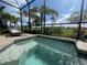 A screened pool and chaise lounge offer relaxation with golf course views at 15618 Castle Park Ter, Lakewood Ranch, FL 34202