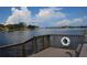 Wooden dock overlooking calm water with houses in the background at 68 4Th Ave, Venice, FL 34285