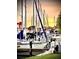 Scenic marina view featuring sailboats docked against a colorful sunset sky near the water's edge at 68 4Th Ave, Venice, FL 34285