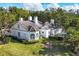 White home with a gray roof and landscaping, seen from above at 75 Osprey Point Dr, Osprey, FL 34229