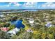 Aerial view of upscale community with water features and lush landscaping at 75 Osprey Point Dr, Osprey, FL 34229