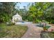 Inviting pool area with patio furniture and lush landscaping at 75 Osprey Point Dr, Osprey, FL 34229