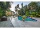 Relaxing pool and patio area with wicker furniture at 75 Osprey Point Dr, Osprey, FL 34229