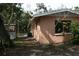 Backyard view of house with mature landscaping at 144 Garden Ln, Sarasota, FL 34242