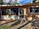 Screened porch with access from the backyard at 144 Garden Ln, Sarasota, FL 34242