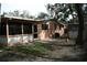 Backyard with screened porch and small shed at 144 Garden Ln, Sarasota, FL 34242