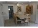 Dining room with large table and access to the bathroom at 144 Garden Ln, Sarasota, FL 34242