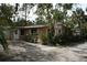 Charming single story home with lush landscaping at 144 Garden Ln, Sarasota, FL 34242
