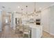 Modern kitchen with white cabinets and a large island at 18122 Harwich Pl, Bradenton, FL 34202