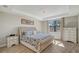 Spacious main bedroom with plush bed and plenty of natural light at 18122 Harwich Pl, Bradenton, FL 34202