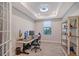 Home office with built-in shelving and plenty of workspace at 18122 Harwich Pl, Bradenton, FL 34202