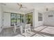 Covered patio with dining set, offering picturesque pool views at 18122 Harwich Pl, Bradenton, FL 34202