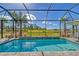 Inviting screened pool with tiled accents and tranquil preserve views at 18122 Harwich Pl, Bradenton, FL 34202