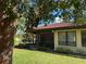 Exterior view of a single story home with red tile roof and a screened patio at 3711 Pinecone Ct # 168, Sarasota, FL 34238