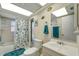 Bathroom with tub shower, vanity, and nautical theme at 12 Golfview Rd, Rotonda West, FL 33947