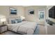 Comfortable bedroom with a queen-size bed and calming blue accents at 15625 San Lazzaro Ave, Bradenton, FL 34211