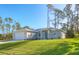 Single-story home with attached garage and landscaped lawn at 2814 Daphne Rd, North Port, FL 34288