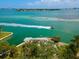 Aerial view of waterfront home with boat and beautiful water at 3200 Higel Ave, Sarasota, FL 34242