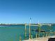 Private boat dock on calm water with city views at 3200 Higel Ave, Sarasota, FL 34242