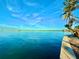 Scenic waterfront view with palm trees and blue skies at 3200 Higel Ave, Sarasota, FL 34242