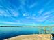 Stunning waterfront view with blue skies and calm water at 3200 Higel Ave, Sarasota, FL 34242